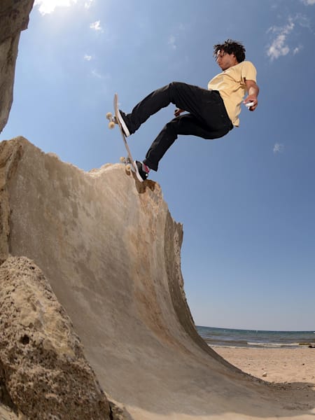 Josef Scott pivots on a natural transition spot on the edge of the Baltic Sea in Latvia.