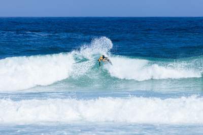 Caity Simmers surfing in Brazil
