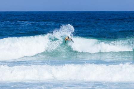 Caity Simmers surfing in Brazil