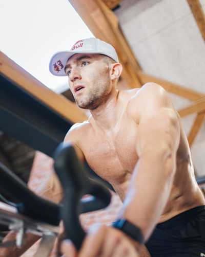 HYROX pro athlete Jake Dearden training on an indoor bike