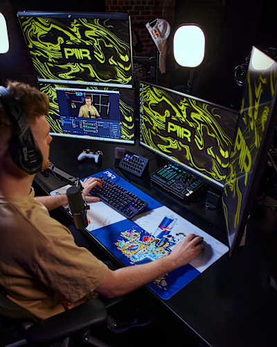 In August 2024, Lachlan 'Lachlan' Power is in action at PWR HQ, Melbourne, energised by Red Bull as he streams from his dynamic gaming setup, surrounded by PWR branding
