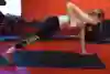 How to perform a plank with dumbells in the gym.