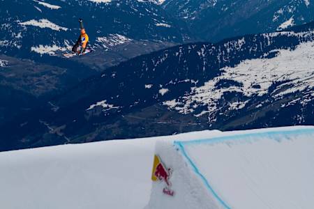Tim-Kevin Ravnjak does a big Backside 180 Indy Grab in the snowpark of Laax