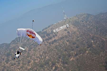 Miles Daisher, of the Red Bull Air Force Team, soars over the Hollywood sign, during LA Swoopers, in Los Angeles, CA, USA, on 20 October 2011.