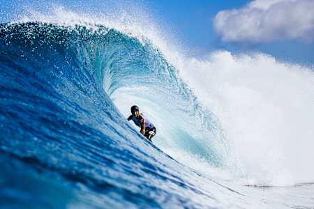 Molly Picklum rides the tube at Backdoor Pipeline in Hawaii. 