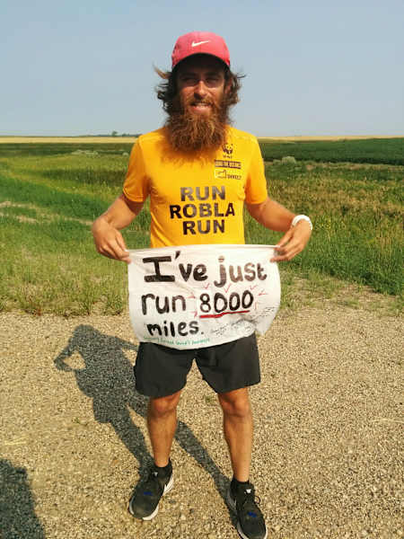 Rob Pope poses near Carrington, North Dakota, having successfully run 8,000 miles.