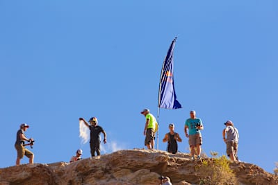 A competitor checks the wind direction during practice for the 2014 edition of Red Bull Rampage in Virgin, Utah, USA.