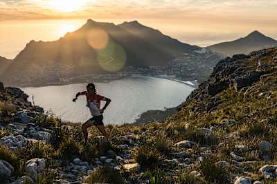Ryan Sandes running with the ocean behind him.