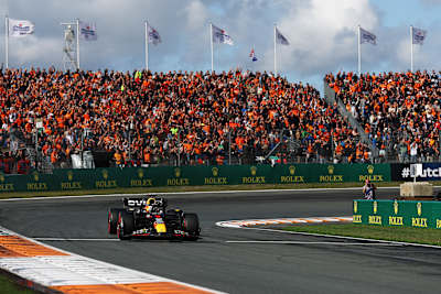 Pole position qualifier Max Verstappen waves to the crowd during qualifying ahead of the F1 Grand Prix of The Netherlands at Circuit Zandvoort on August 26, 2023. 