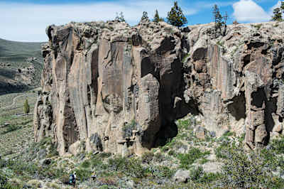 Participants run near rock columns during Race the Planet in Patagonia.