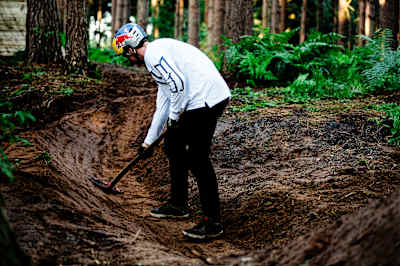 Matt Jones touches up the run during a trail build for his Frames of Mind project.