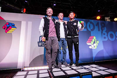 Sebastian Weyer (left), Feliks Zemdegs (centre), Bill Wang (right) in Boston at the Red Bull Rubik's Cube World Championship.