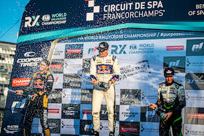Johan Kristoffersson celebrates on the podium with Kevin Hansen and Krisztían Szabó.