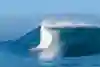 Surfer Nathan Florence takes off on a Backdoor Pipeline wave