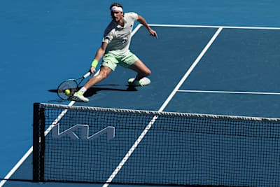 Greece's Stefanos Tsitsipas hits a return against Belgium's Zizou Bergs during their men's singles match on day two of the Australian Open tennis tournament in Melbourne on January 15, 2024.