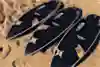 Julian Wilson's custom made carbon fibre surfboards sit on the beach in Newcastle, Australia.