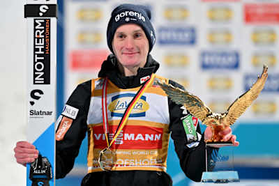 Domen Prevc with the Golden Eagle for winning the Four Hills Tournament in 2026