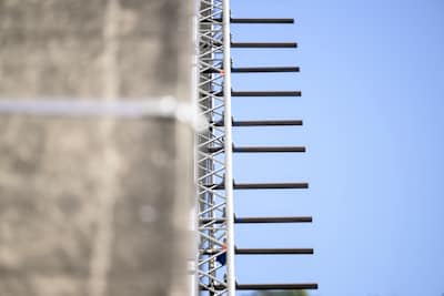 The rigging at the Bloukrans Bridge in the Tsitsikamma, South Africa containing 600 monkey bars suspended beneath the bridge's arch – for  Thomas van Tonder's Red Bull Bridge Bars challenge.