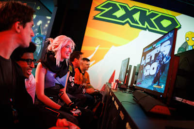 Fans are seen playing 2XKO at VALORANT Champions Paris Fan Fest at Accor Arena on October 3, 2025 in Paris, France