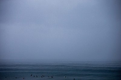 A crowded line up waits for the next set at the famous Pipeline surf break on the North Shore of Oahu, Hawaii.