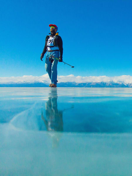 Peter Messervy-Gross walks over a frozen lake in Mongolia wearing jeans and brogues.