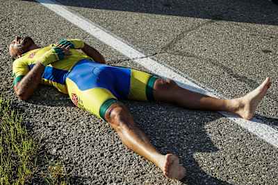 Cyclist lying on the ground