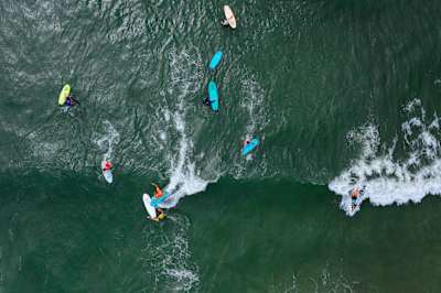 Participants surf at Red Bull Foam Wreckers in Ocean City, New Jersey