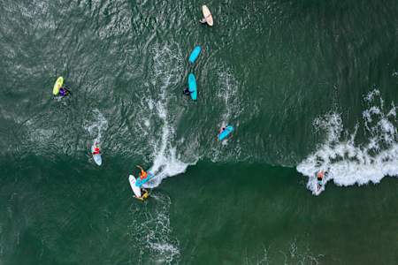 Participants surf at Red Bull Foam Wreckers in Ocean City, New Jersey