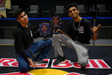 Prithvi and Kemio pose with their trophies.