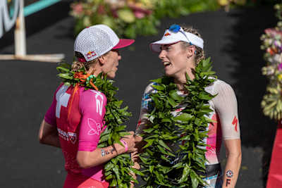 Lucy Charles and Daniela Ryf chatting at the podium at IRONMAN.