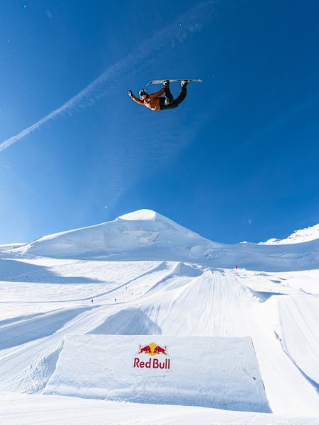 On September 28, 2025, Brock Crouch soars high with a stylish Method Air during the Red Bull Performance Camp in Saas-Fee, Switzerland.