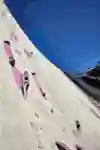In 2024, Jessica Pilz climbs a towering man-made rock route at Verzasca Dam during Red Bull Dual Ascent finals in Switzerland