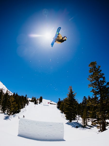 In 2023, Hiroto Ogiwara snowboarding at Red Bull Snow Team Session in Mammoth Lakes, against a pristine mountain backdrop.