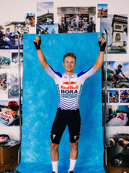 Sebastian Putz of Team Red Bull   BORA   hansgrohe raises his arms in celebration during a photo shoot on 21 October 2025 in Fuschl am See, Austria