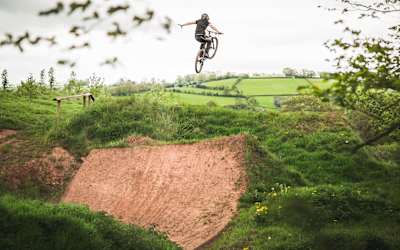 Veronique Sandler performs a No-Hander over a jump at at Black Mountains Cycle Centre in Wales.
