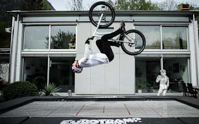 MTB trials rider Fabio Wibmer Backflips on his trampoline during filming of his video Home Office.