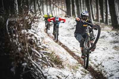 Matt Jones, Jono Jones and Kriss Kyle manual on a MTB trail in Scotland.