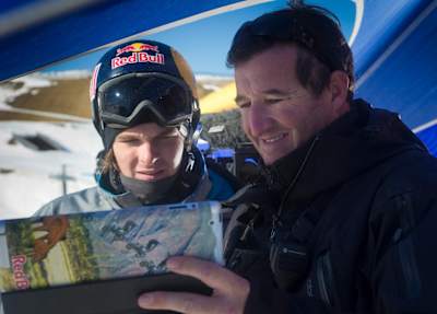 Snowboarder Seppe Smits gets tips from his coach.