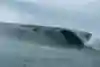 Justine Dupont rides a huge wave at Mavericks in California