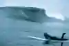 Justine Dupont paddling out at Mavericks.