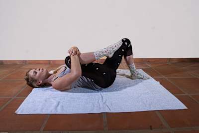 Anna Glowinski demonstrates stretches for cyclists.