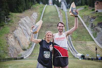 Madison Sands and Alexandre Ricard hold up their winner awards at RB400 Whistler.
