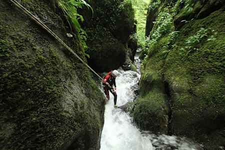 A Canyoner gets down to a Canyon in Dollar Falls in Scotland.