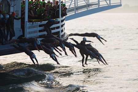 Participants begin by diving from a ferry off the shores of Alcatraz Island