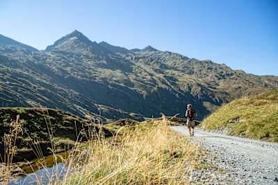 Walking along gravel road towards mountains in the Zell am See region.