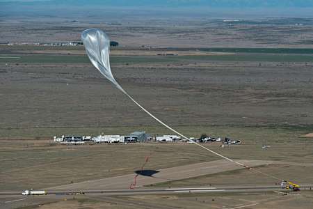 The crane follows the balloon with the capsule at the flight line during the final manned flight for Red Bull Stratos in Roswell, New Mexico, USA on October 14, 2012.