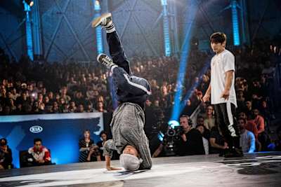 Ayumi does an elbow freeze with Kill in the background.