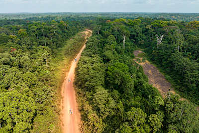 Trucks on a dusty jungle track in Ivindo National Park, Gabon.