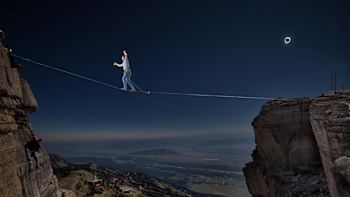 Alex Mason highlines the solar eclipse in Jackson Hole, Wyoming.