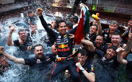 Race winner Sergio Perez celebrates with his team by jumping into the pool after the F1 Grand Prix of Monaco at Circuit de Monaco on May 29, 2022 in Monte-Carlo, Monaco. 